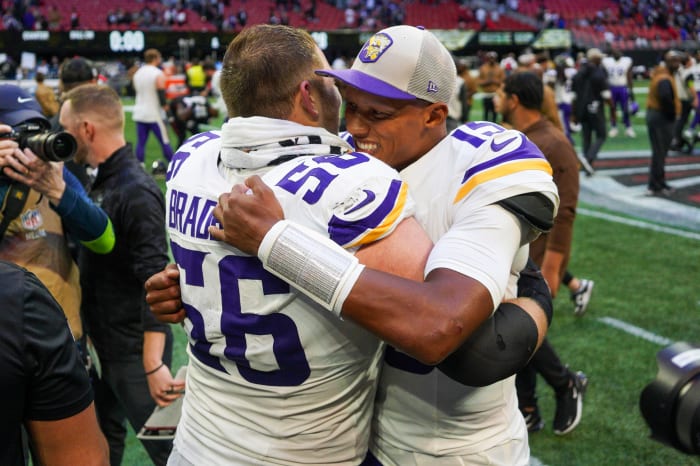Nov 5, 2023; Atlanta, Georgia, USA; Minnesota Vikings center Garrett Bradbury (56) and quarterback Joshua Dobbs (15) hug after a victory against the Atlanta Falcons at Mercedes-Benz Stadium.